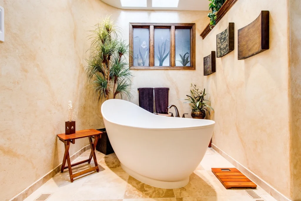 Elegant spa-inspired bathroom featuring a freestanding tub and natural decor. 