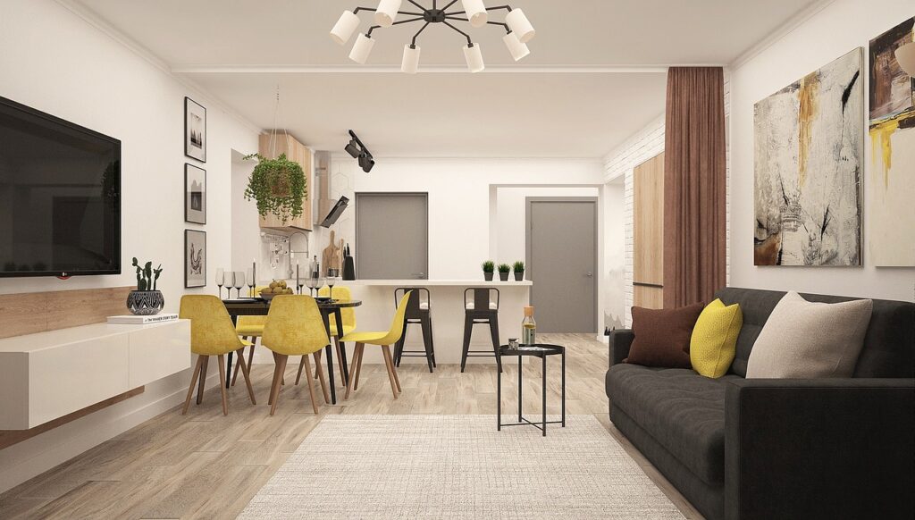 Open-concept home addition combining a modern kitchen, dining area, and living space in one seamless layout